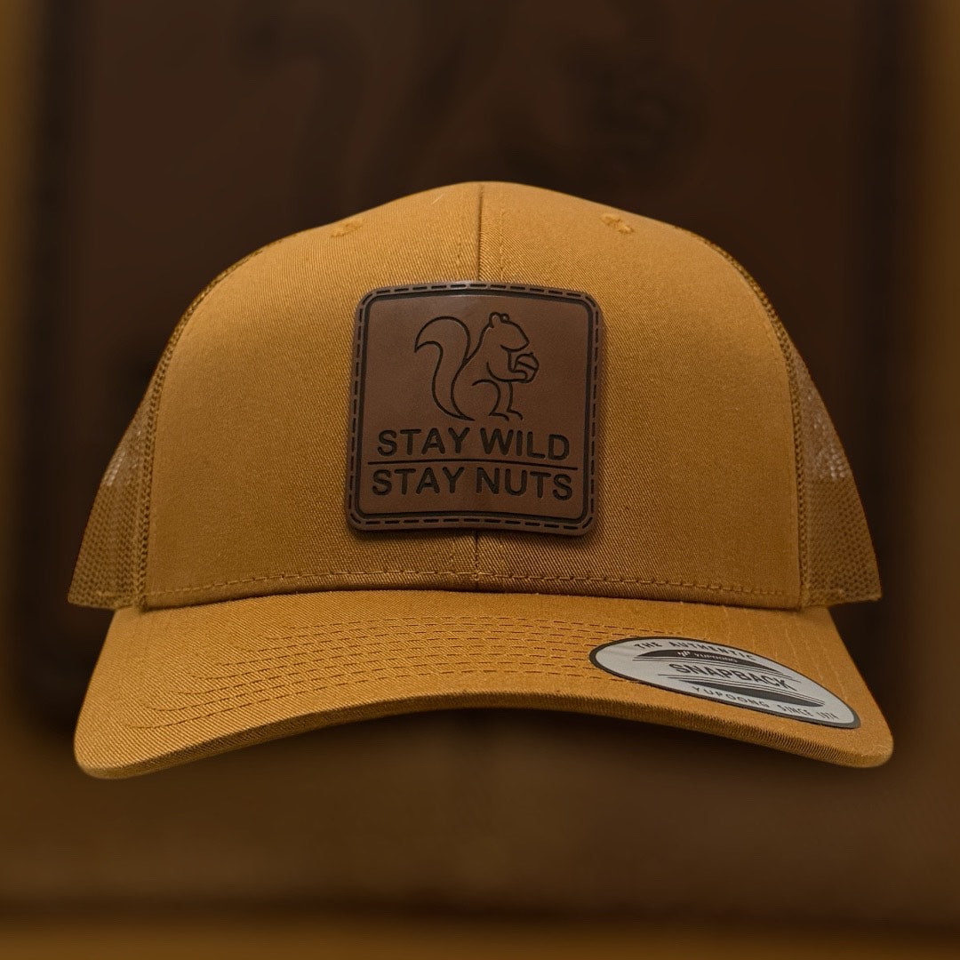 Brown cap with a leather patch featuring a squirrel and text on a brown background